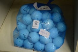 A bag of fifty Srixon golf balls.