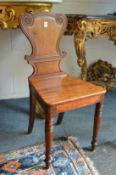 A 19th century mahogany hall chair.