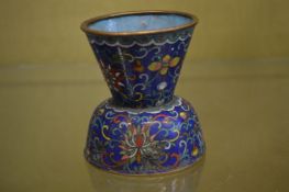 A small cloisonne vase.