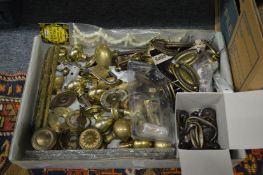 A quantity of brass door and furniture fittings.
