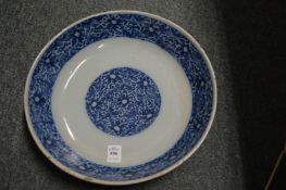 An 18th century delft blue and white circular dish.