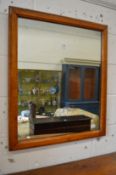 A maple framed mirror.