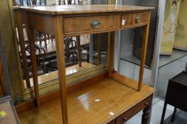 A mahogany bow front two drawer side table.