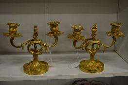 A pair of ormolu twin branch candelabra.