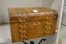 A Victorian sewing box.