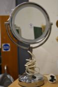 A magnifying illuminated makeup mirror.