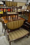 An Edwardian seven-piece mahogany salon suite.