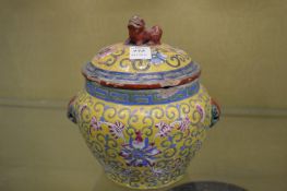 A Chinese yellow ground bowl and cover.