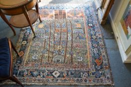 An unusual Persian rug, beige ground with stylised decoration 195cm x 155cm.