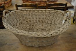 A wicker twin handled basket.
