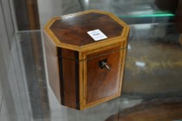 A Georgian design mahogany and satinwood banded tea caddy.