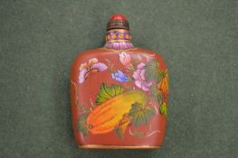 A Chinese lacquer snuff bottle.