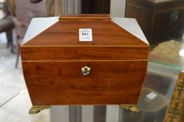 A mahogany sarcophagus shaped tea caddy.