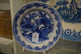A small 19th century delft blue and white plate.