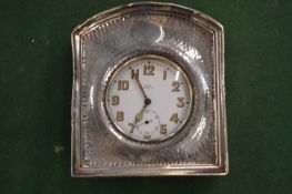 A silver cased travelling watch.