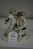 A small Meissen group of two cherubs (af).