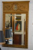 A gilt framed pier mirror with decorative cresting.