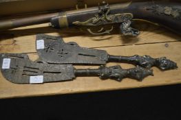 A near pair of Dogen bronze ceremonial fertility swords.