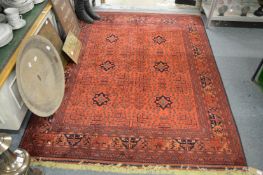 A good modern Persian design rug, claret ground with stylised design 205cm x 155cm.