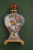 A Chinese porcelain snuff bottle and stopper.