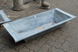 A galvanised garden trough/planter.
