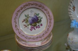 A set of eleven Sevres fruit decorated side plates.