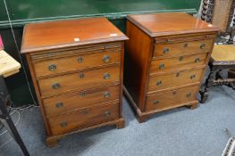 A pair of mahogany small four drawer chests with brushing slide.