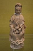 A Chinese porcelain figure of Guanyin.