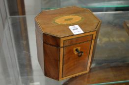 A Georgian style mahogany and satinwood tea caddy.
