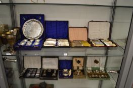 A quantity of cased plated flatware, silver condiment sets, pair of cased silver salts etc.