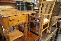 A modern oak armchair, a pine mirror and bedside table.