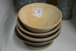 Five Chinese terracotta bowls.