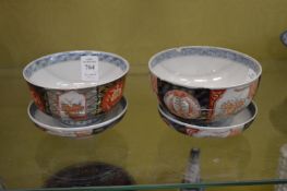 A pair of imari bowls and covers.
