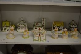 A quantity Pastel Burner cottages and Royal Doulton Bramley Hedge mice.