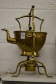 A Victorian brass kettle on stand.