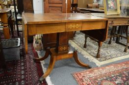 A Regency brass inlaid rosewood sofa table.