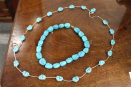 Two chunky bead necklaces.