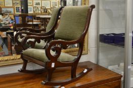 A child's mahogany framed rocking chair.