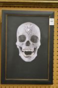 In the manner of Damien Hirst, crystal skull, photographic print.