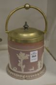 A jasperware biscuit barrel with plated mounts.