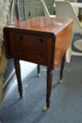 A 19th century mahogany two drawer drop flap worktable.