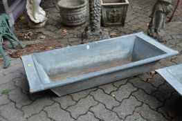 A galvanised garden trough.