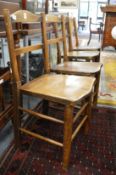 A set of eight beech and elm country dining chairs.