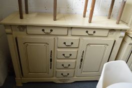 A large French style cream painted dresser base.