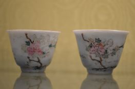A pair of small Chinese famille rose teacups.