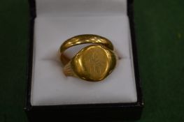 Two 9 carat gold rings.
