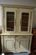 A large French style cream painted dresser with glazed upper section.