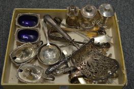 Silver condiments and other items of small silverware.
