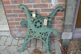 A pair of cast iron bench ends.
