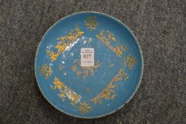 A pale blue enamelled dish with gilded decoration.